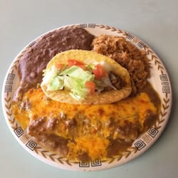Canales Cafe - Our most popular plate:Mexican plate;consists of two enchiladas ,rice ,beans and a crispy taco