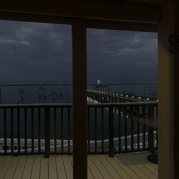 Yellow Dog Cafe - Evening view of the pier and Melbourne Beach in the distance. - Seafood Near Me - Malabar, Florida Yellow Dog Cafe - Evening view of the pier and Melbourne Beach in the distance. - Seafood Near Me - Malabar, Florida