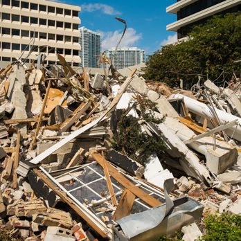 28 Blue Construction - a pile of rubble in front of a building - Excavation Services Near Me