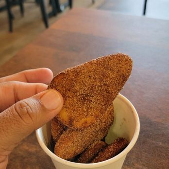 Tikka Bowls and Tacos - a hand holding a piece of bread - Indian Near Me - Saint Johns, Florida Tikka Bowls and Tacos - a hand holding a piece of bread - Indian Near Me - Saint Johns, Florida