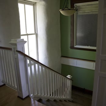 Milkweed Mercantile Llc - Staircase with hand-crafted banister, reclaimed hardwood floors, and strawbale exterior walls. - Hotels Near Me - Rutledge, Missouri Milkweed Mercantile Llc - Staircase with hand-crafted banister, reclaimed hardwood floors, and strawbale exterior walls. - Hotels Near Me - Rutledge, Missouri