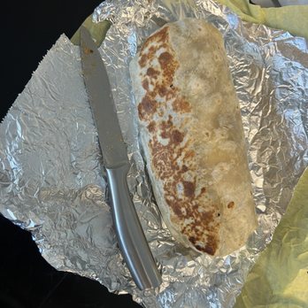 Speedy Burritos - Regular size breakfast burrito with knife for size comparison - Mexican Near Me - Reno, Nevada