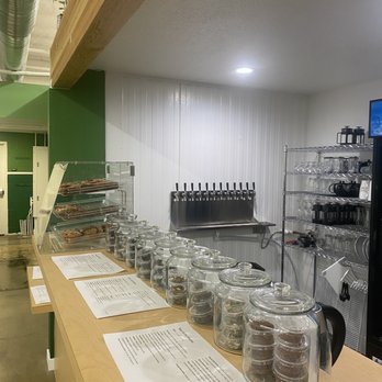 Beer for the Meeples - a row of bottles on a counter - Beer Bar Near Me - Clovis, California
