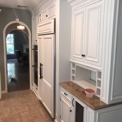 Buckman Interiors - Painting kitchen cabinets and bathroom vanities . Don't replace, paint!