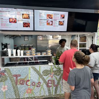 Tacos El Fluffy - a group of people ordering food - Mexican Near Me - Pensacola, Florida