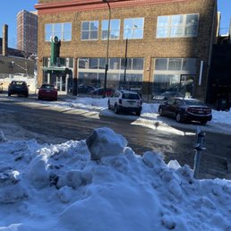 a pile of snow in front of a building