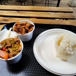 a plate of rice and a bowl of stew a plate of rice and a bowl of stew