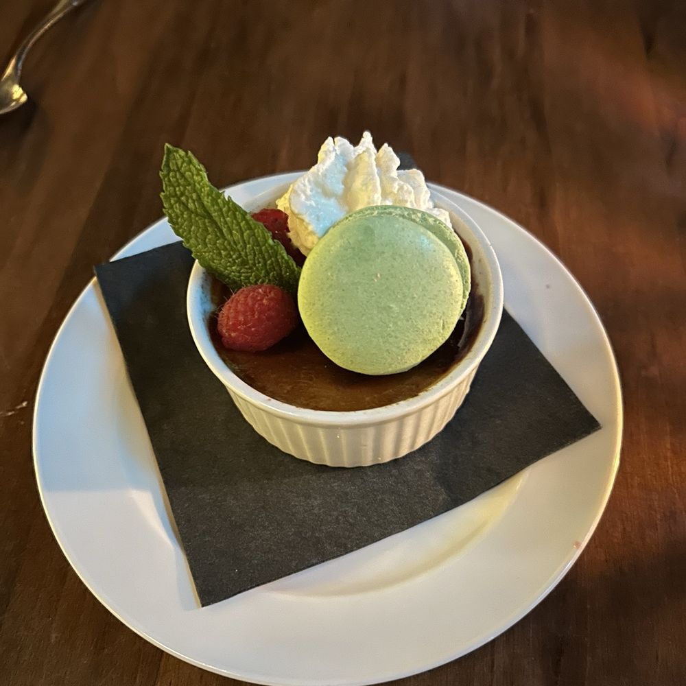 Creme brûlée and a pistachio macaron for dessert. Creme brûlée and a pistachio macaron for dessert.