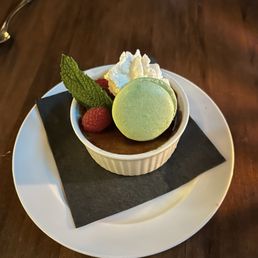 Creme brûlée and a pistachio macaron for dessert. Creme brûlée and a pistachio macaron for dessert.