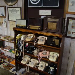 Pluemers Antiques & Collectables - Some vintage telephones & old tube radios.