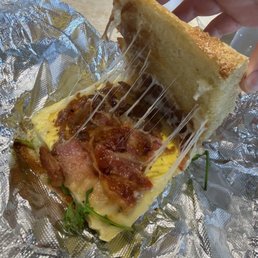 Bacon, arugula, and swiss breakfast sandwich Bacon, arugula, and swiss breakfast sandwich