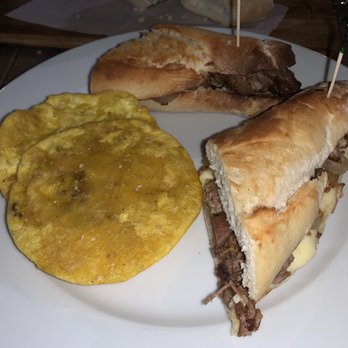 Montecatini Restaurant - Pork sandwich with tostones. - Italian Near Me - Miami, Florida