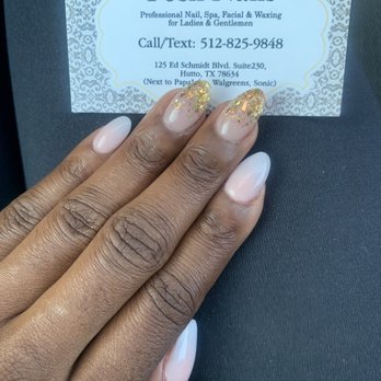 Posh Nails - Almond shaped ombré nails with two fingers gold sparkle. My hands are on the dryer side so my skin peels around the nail bed - Nail Salons Near Me - Hutto, Texas