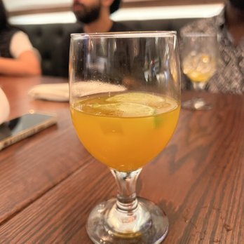 Kantu Peruvian Cuisine - a glass of orange juice - Peruvian Near Me - Queens, New York Kantu Peruvian Cuisine - a glass of orange juice - Peruvian Near Me - Queens, New York