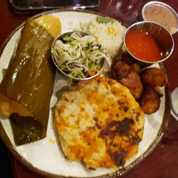 Tamale platter with Papua, plantains, slaw and rice