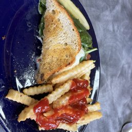 Mozzarella/spinach/basil/tomato herb grilled cheese on sour dough