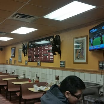 Los Gallos 2 - a man sitting at a table in a restaurant - Mexican Near Me - Chicago, Illinois