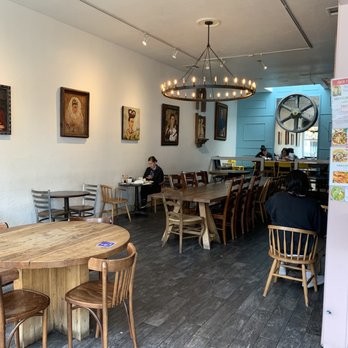 Casa Latina - a dining area with tables and chairs - Mexican Near Me - Berkeley, California