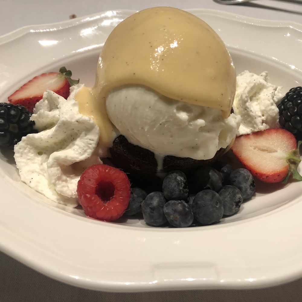 The Village Bistro - Chocolate molten cake. Decadent offset by fresh berries. Yumm - Wine Bars Near Me - Napa, California The Village Bistro - Chocolate molten cake. Decadent offset by fresh berries. Yumm - Wine Bars Near Me - Napa, California