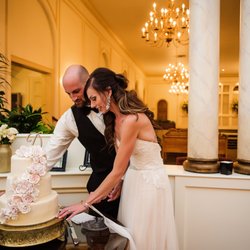 The Old Meeting House - Bride and Groom cutting the cake.