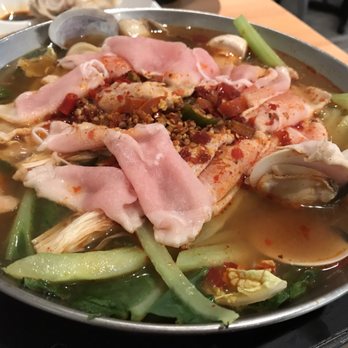 Fahrenheit Asian - Thai hot pot with sliced pork, clams, mushrooms, cabbage, and cucumber - Asian Fusion Near Me - McLean, Virginia
