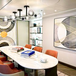 LS Art Consulting - Printed, stretched, and hand embellished canvases on a cruise ship. As well as curated accessories on the shelf.