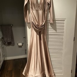 Dress was altered from the shoulders! Great job.