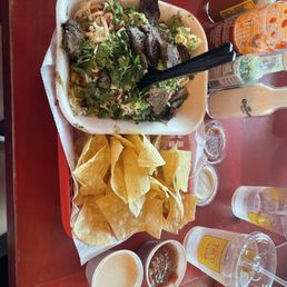 Burrito bowl with many adds like guacamole, pico, onions, rice, cilantro, etc.... With chips and mild salsa and chipotle ranch Burrito bowl with many adds like guacamole, pico, onions, rice, cilantro, etc.... With chips and mild salsa and chipotle ranch