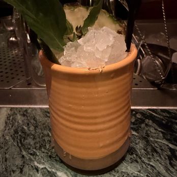 Crying Tiger - pineapple macerated flecha azul repo tequila thai coconut colada with thai basil over crushed ice - Thai Near Me - Chicago, Illinois