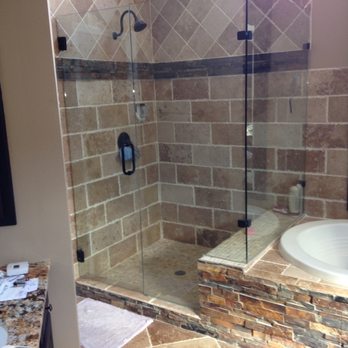 Always Working - a bathroom with a shower and a bathtub - General Contractors Near Me Always Working - a bathroom with a shower and a bathtub - General Contractors Near Me
