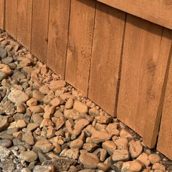 Rock Solid Fence - Stain overspray on rocks