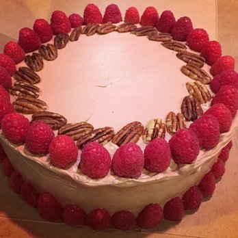 Green Plate Catering - Boxing up a birthday cake. Dark Chocolate with chocolate butter cream meringue frosting with pecans and raspberries - Caterers Near Me Green Plate Catering - Boxing up a birthday cake. Dark Chocolate with chocolate butter cream meringue frosting with pecans and raspberries - Caterers Near Me