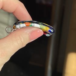 Side view of Venetian Bead Shop 20x40mm curved rectangle millefiori Murano glass pendant with silver bail