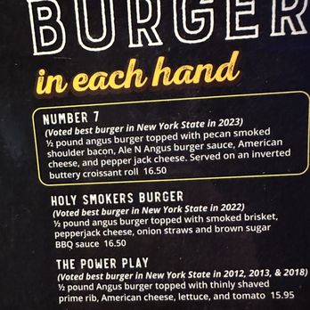 Ale N  Angus Pub -  menu for a burger in each hand - Pubs Near Me - Syracuse, New York