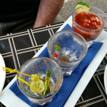Girardi's Osteria - oyster shooters, Jarred? bc his 3 were all different tasting. Mine too. 1 big spawning (creamy thing), 1 small briny, 1 small different...? - Italian Near Me - Edmonds, Washington