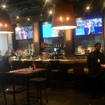Cheddar's Scratch Kitchen - Bar area with tables and booths.  4 HDTVs above bar - Comfort Food Near Me - Denton, Texas