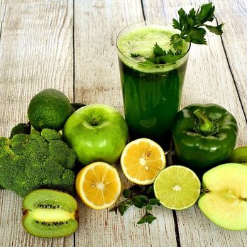 West End Nutrition - a glass of green juice surrounded by fruits and vegetables - Vitamins & Supplements Near Me - Dubuque, Iowa West End Nutrition - a glass of green juice surrounded by fruits and vegetables - Vitamins & Supplements Near Me - Dubuque, Iowa