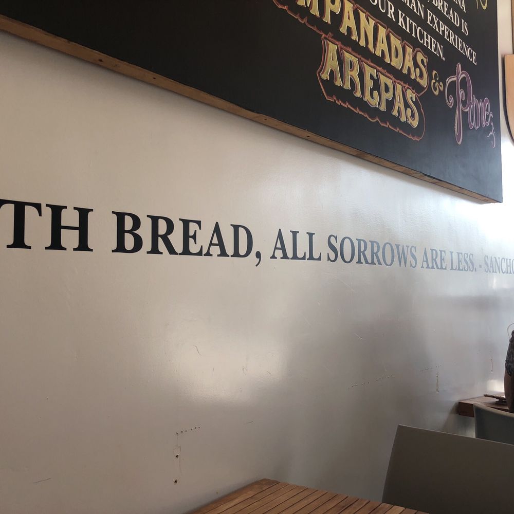 Panamericana Bakery - a woman sitting at a table - Bakeries Near Me - Los Angeles, California