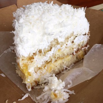 Cafe Zocalo - Coconut cake slice. Has pineapple and pastry cream between the layers, and a whipped cream outer. Huge slice and pretty moist. - Bakeries Near Me - Orange, California Cafe Zocalo - Coconut cake slice. Has pineapple and pastry cream between the layers, and a whipped cream outer. Huge slice and pretty moist. - Bakeries Near Me - Orange, California