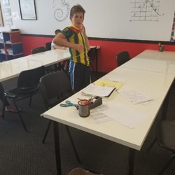 Mathnasium - Challenge: fit your entire body through and index card!
