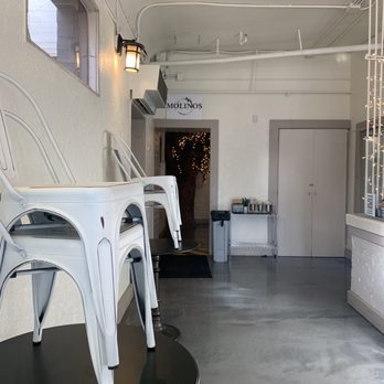 Molinos Coffee - Down that hall is a somewhat hidden inside seating area that is closed but still looked great ! - Coffee & Tea Near Me - Redlands, California