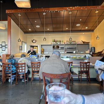 Shinsei Sushi - a man holding a glass of water - Japanese Near Me - Medford, Oregon