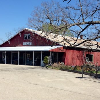Peebles Flower Shop - This is the barn/building. Little worn; peeling paint."Antiques" sign hanging high. Stuff on the front "porch" and inside. - Florists Near Me - Peebles, Ohio