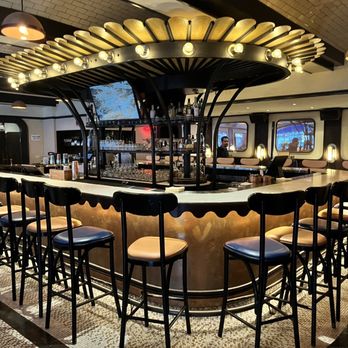 Rochambeau - a bar with chairs and tables - French Near Me - Boston, Massachusetts Rochambeau - a bar with chairs and tables - French Near Me - Boston, Massachusetts