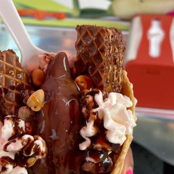 Munchies Wild Waffle Cone - a hand holding a waffle cone - Ice Cream & Frozen Yogurt Near Me Munchies Wild Waffle Cone - a hand holding a waffle cone - Ice Cream & Frozen Yogurt Near Me