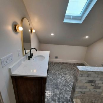 JZF Renovations - a bathroom with a skylight - General Contractors Near Me JZF Renovations - a bathroom with a skylight - General Contractors Near Me