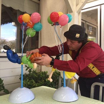 Mr Balloonatic - Michael, Mr. Balloonatic perfecting a centerpiece for an Up Themed wedding reception. - Clowns Near Me - Glenageary, D