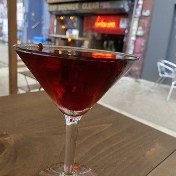 Botanica Bar - a glass of red wine on a table - Beer Bar Near Me - New York, New York Botanica Bar - a glass of red wine on a table - Beer Bar Near Me - New York, New York