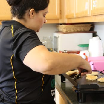 Snack Shack - a woman preparing food in a kitchen - Cafes Near Me - Los Gatos, California Snack Shack - a woman preparing food in a kitchen - Cafes Near Me - Los Gatos, California