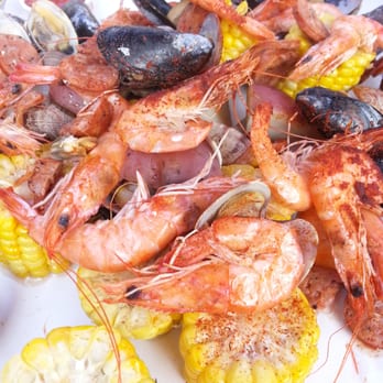 The Crab Pot - Plop (as its being poured in front of you); The Cove $18. Per person: Shrumps, Clams, Muscles, Carn, Potatoes, Butter & Bread - Seafood Near Me - Seattle, Washington The Crab Pot - Plop (as its being poured in front of you); The Cove $18. Per person: Shrumps, Clams, Muscles, Carn, Potatoes, Butter & Bread - Seafood Near Me - Seattle, Washington